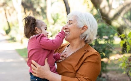 child booping grandparent's nose