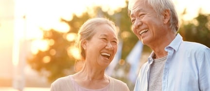 senior couple outside during sunset