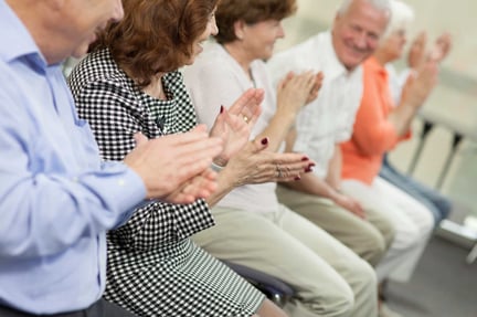 seniors clapping after a presentation