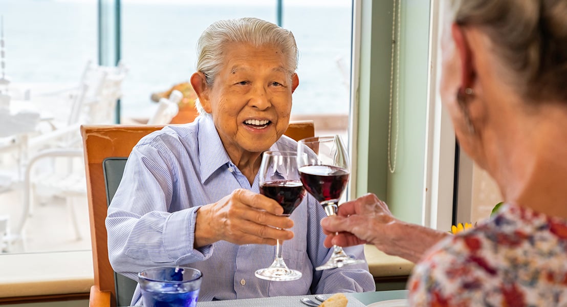 Senior couple toasting with wine