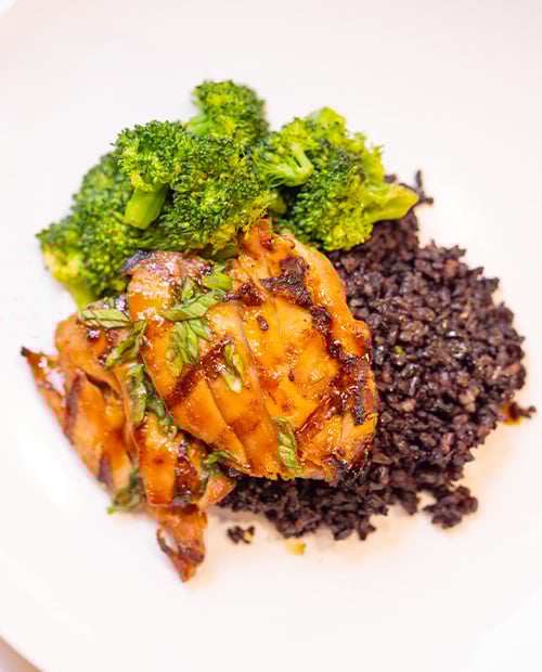 Close-up of a plate of grilled chicken and broccoli