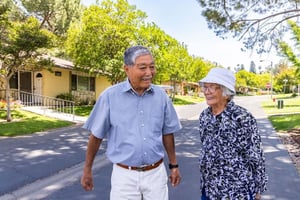 Senior man and woman walking around Plymouth Village