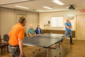 Two senior men playing table tennis