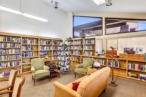 Seating area in the library at Plymouth Village