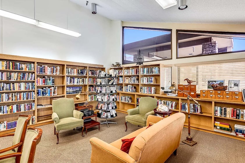 Seating area in the library at Plymouth Village