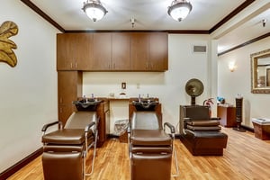 Shampoo bowls and hair dyer in the Plymouth Village salon