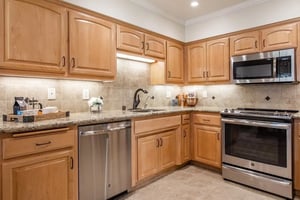 Blonde wood kitchen cabinets in a Plymouth Village home