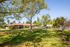 Central green at Plymouth Village with houses around it