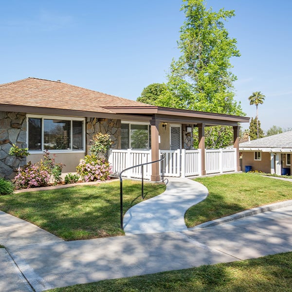 Exterior of a single-level home at Plymouth Village, a HumanGood Life Plan Community in Redlands, California