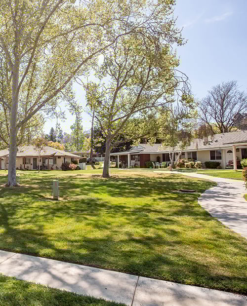 Walking paths and green space in front of homes at Plymouth Village