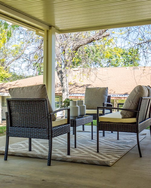 Seating area on a private patio of a Plymouth Village home