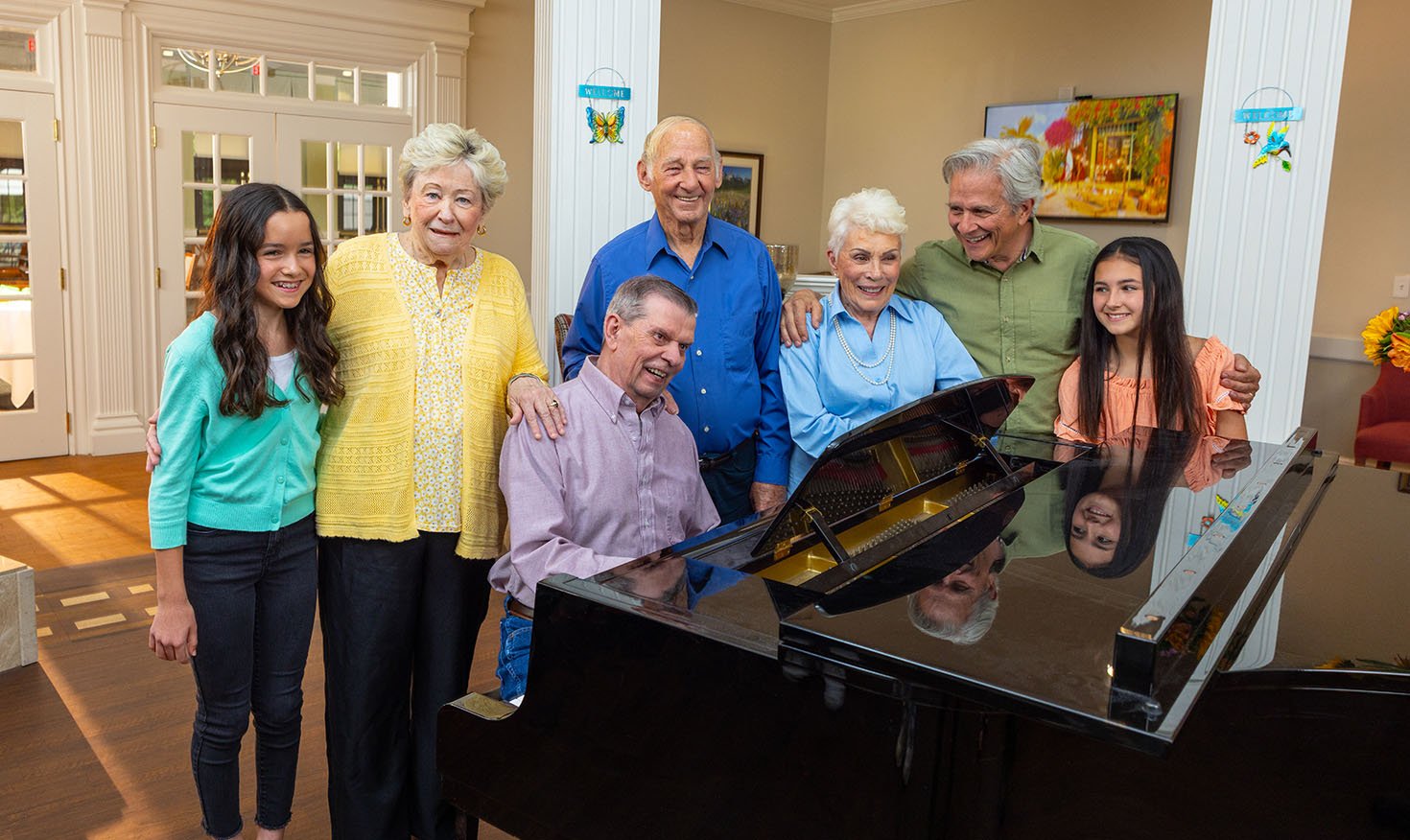 Family gathered around a grand piano