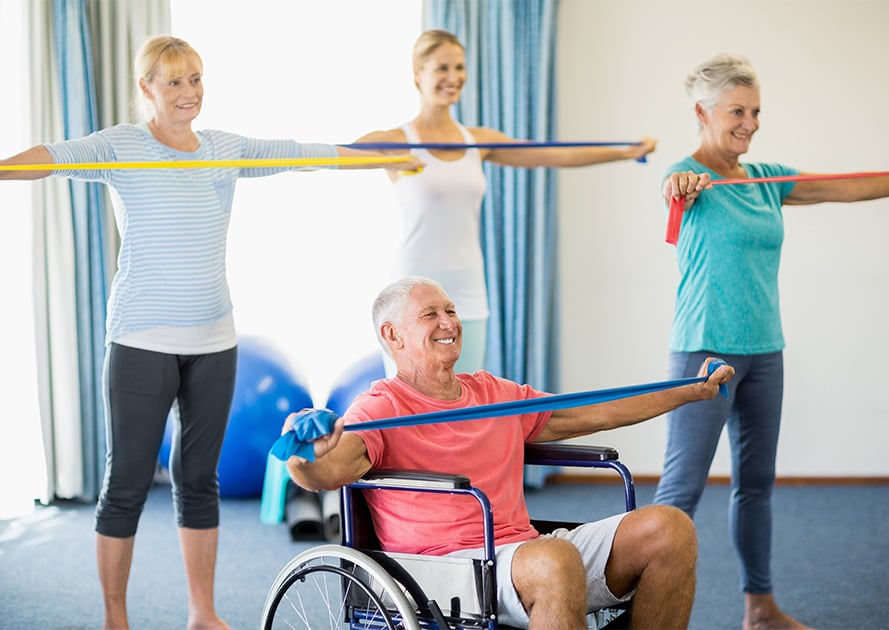 Seniors in a fitness class using resistance bands