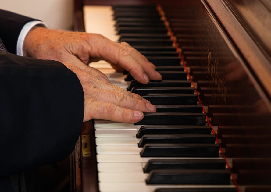 Close-up of a senior playing the piano