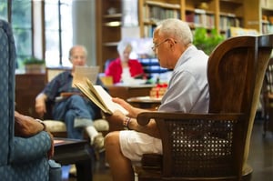 Seniors reading in the Westminster Gardens library