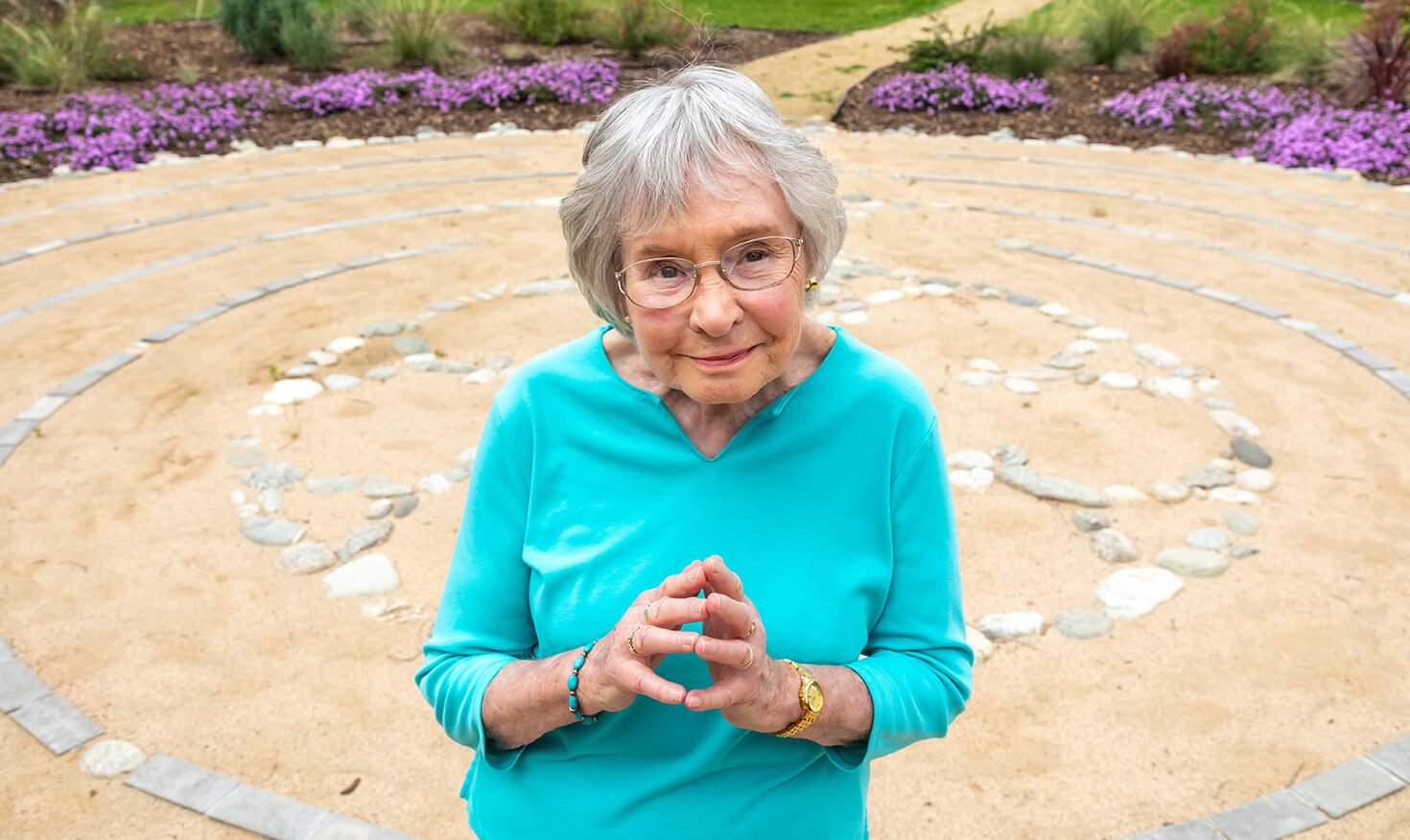 Senior woman standing in the labyrinth on the grounds of Westminster Gardens