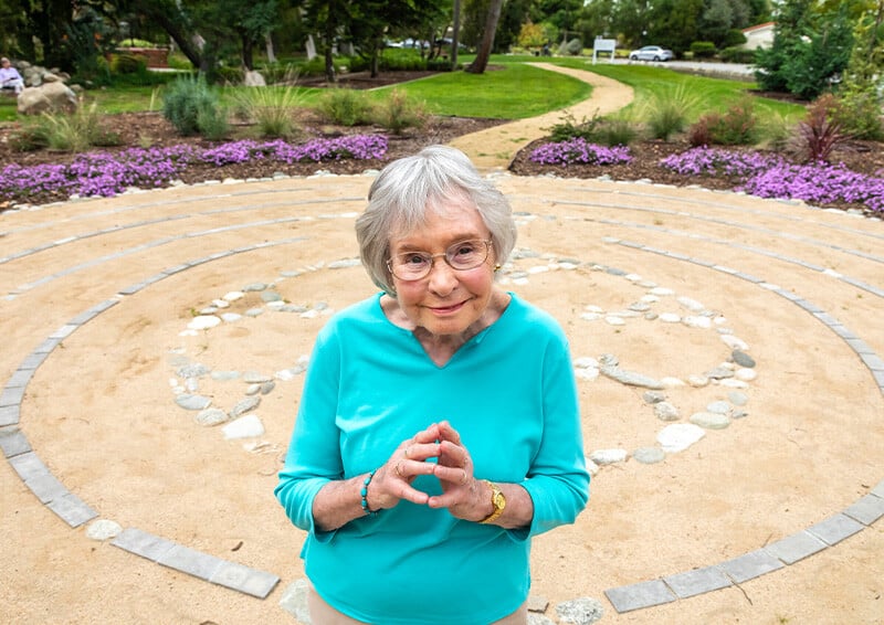 Senior woman standing in the labyrinth on the grounds of Westminster Gardens