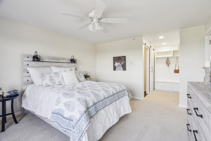 Rosewood bedroom showing bed and view into hallway/closet