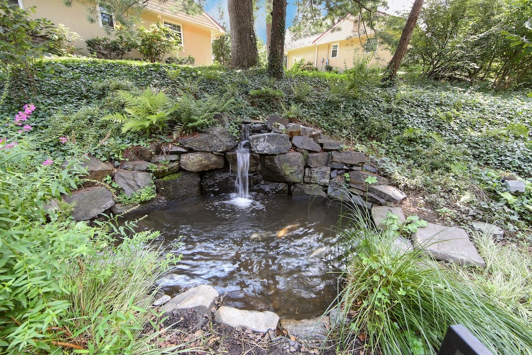A small waterfall and pond at The Mansion at Rosemont