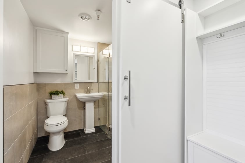 Rosewood bathroom with closet view showing