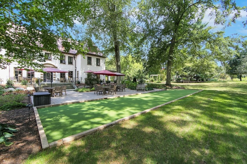 The Mansion at Rosemont backyard patio and a putting green