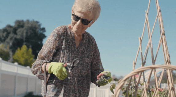 Resident tending to her garden