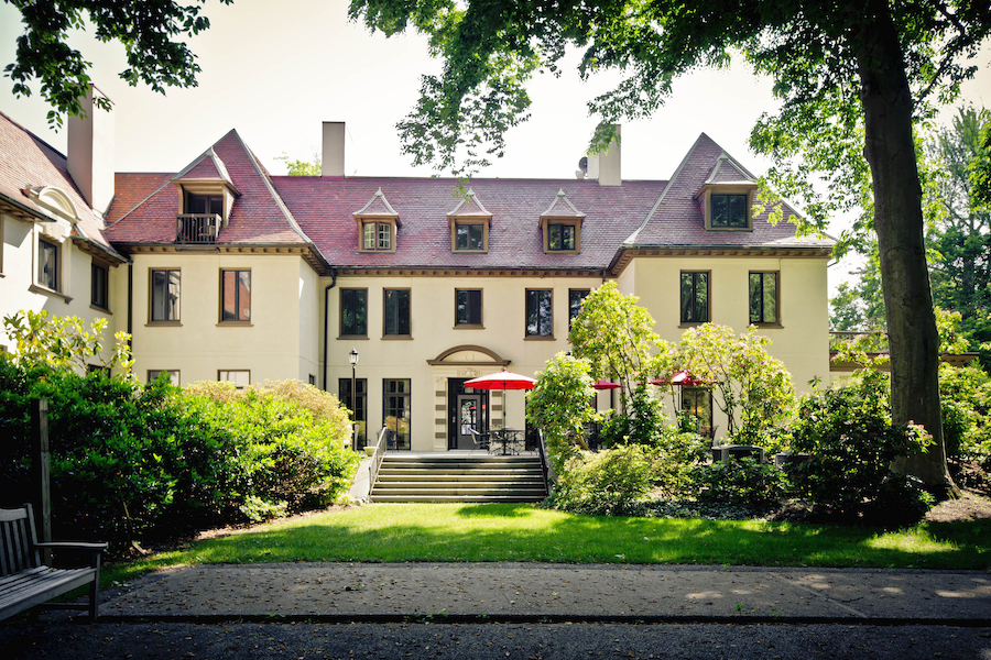 Back entrance with patio of The Mansion at Rosemont