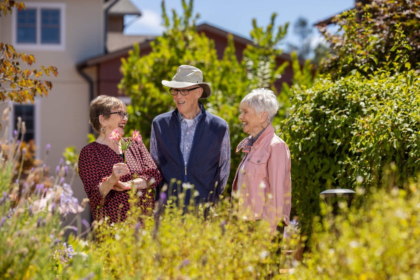 3 People Talking with Grasses in the Foreground