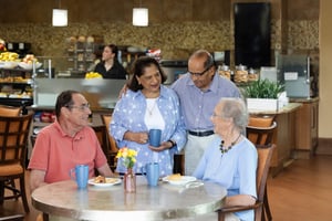 Four People Talking in The Terraces at Los Altos Café