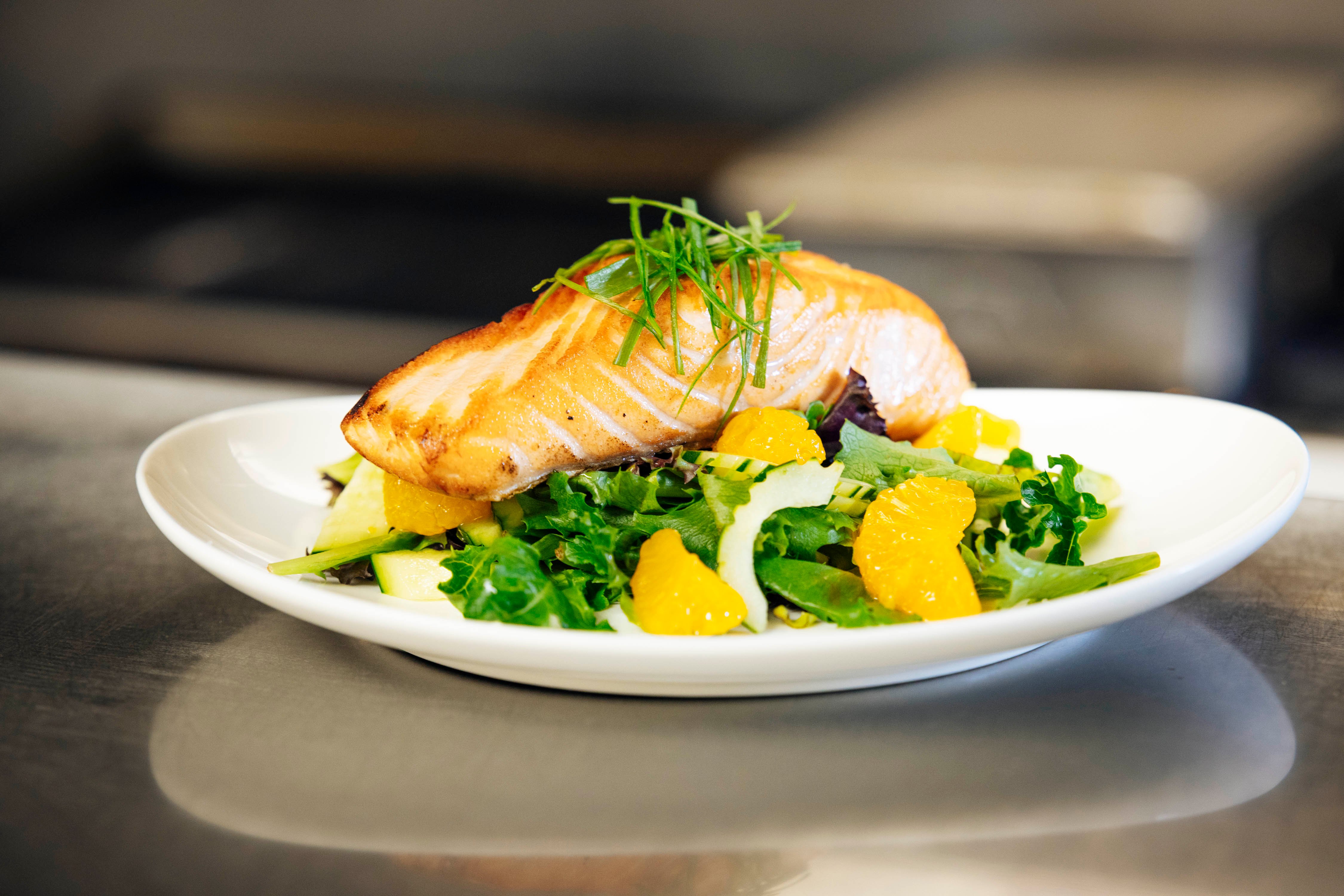 Plate of salmon, avocado, and asparagus