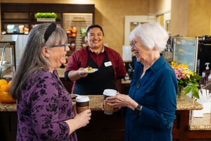 Two women at coffee bar counter