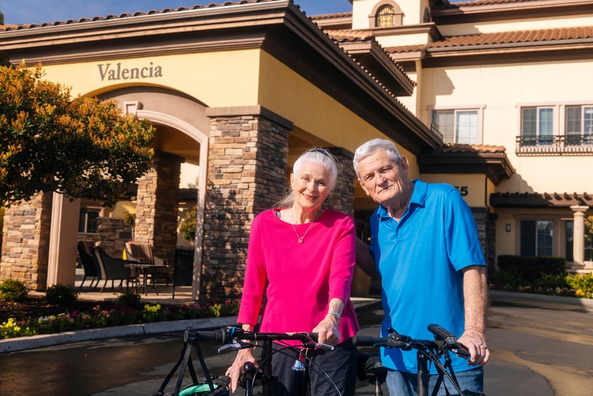 Couple at portico with bikes