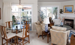Living room and dining area of an apartment at White Sands La Jolla