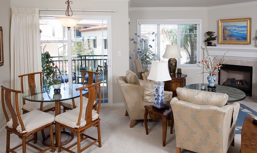 Living room and dining area of an apartment at White Sands La Jolla