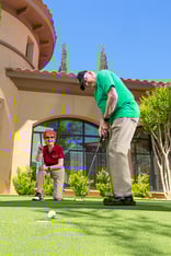 seniors practicing their putt on a putting green