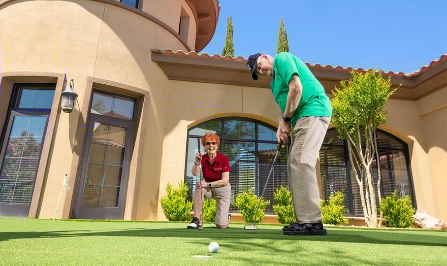 seniors practicing their putt on a putting green
