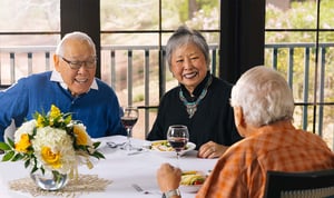 seniors having lunch and wine together