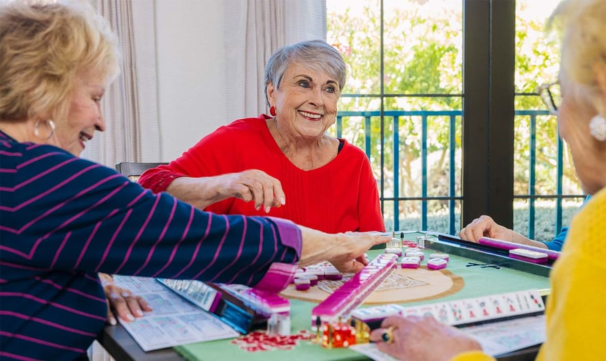 Senior friends playing a board game