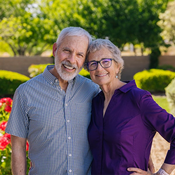Smiling senior couple outside at Las Ventanas at Summerlin