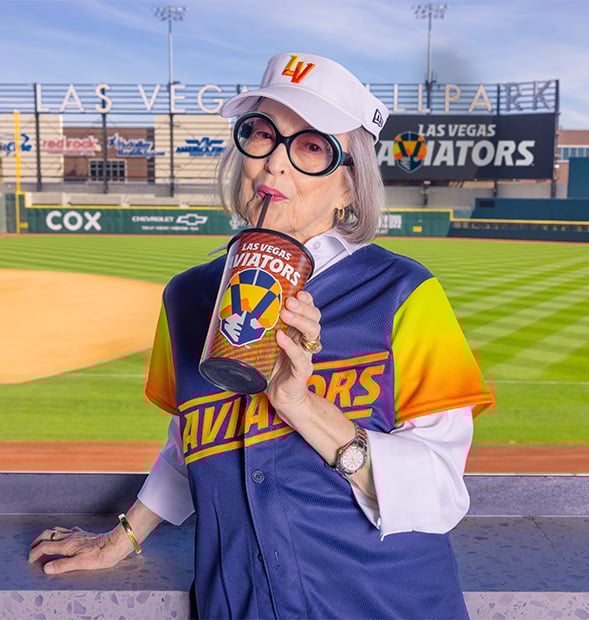Senior woman sipping a soda at Las Vegas Ballpark