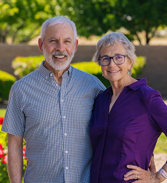 Brent and Karen smiling outside