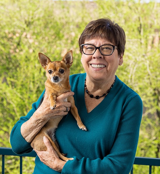 Susan holding a small dog