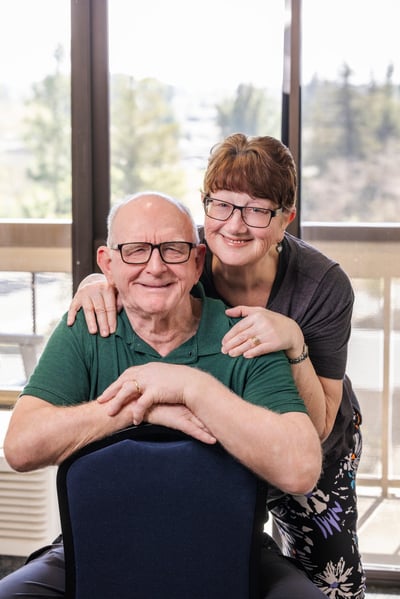 A man and woman posing for a photo