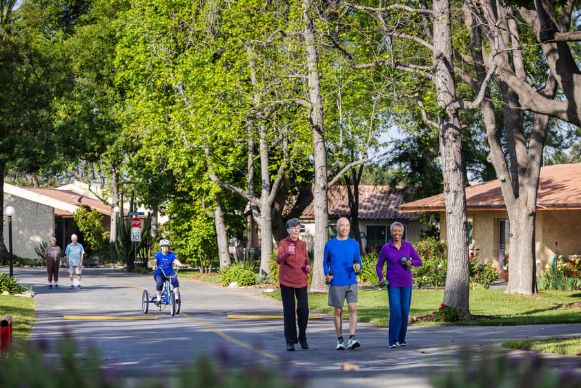 Three people walking in their neighborhood