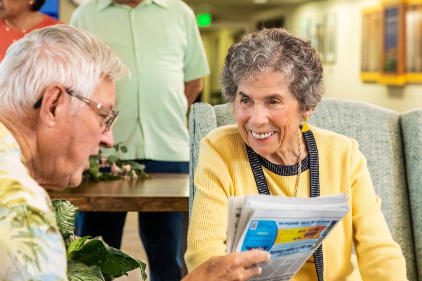 two seniors discussing the news