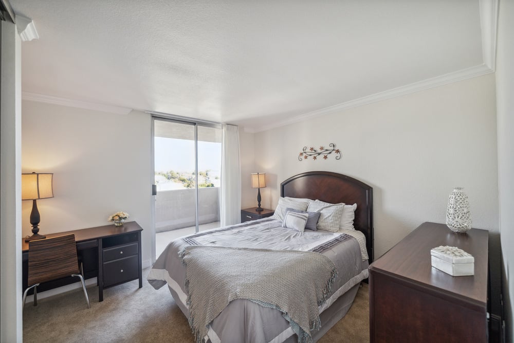  gray bedroom with more balcony