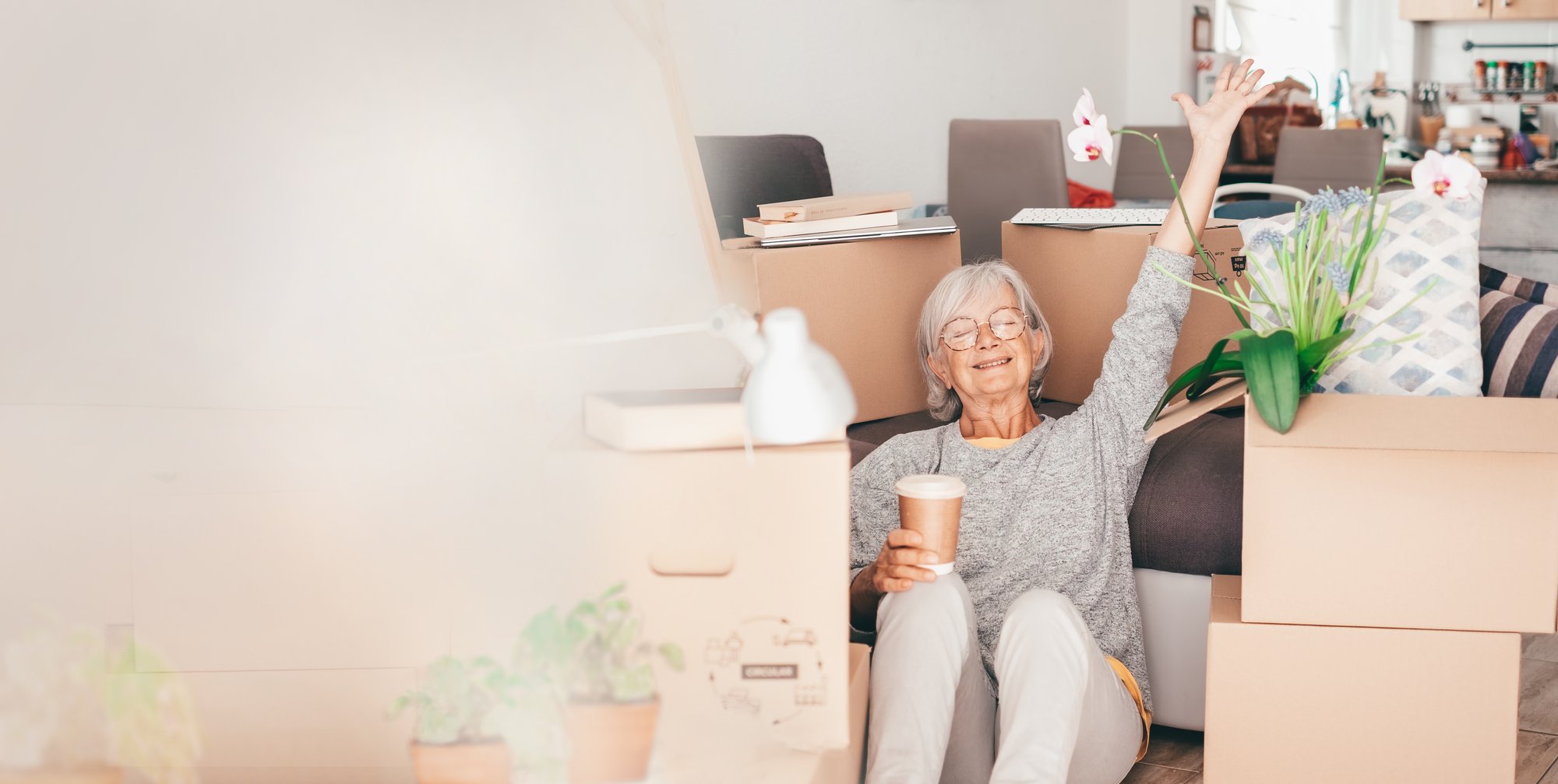 Woman smiling while unpacking in a new home