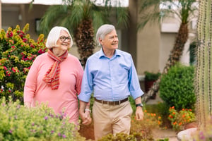 couple walking on lush campus