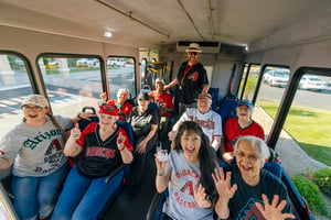 Residents on bus for baseball excursion