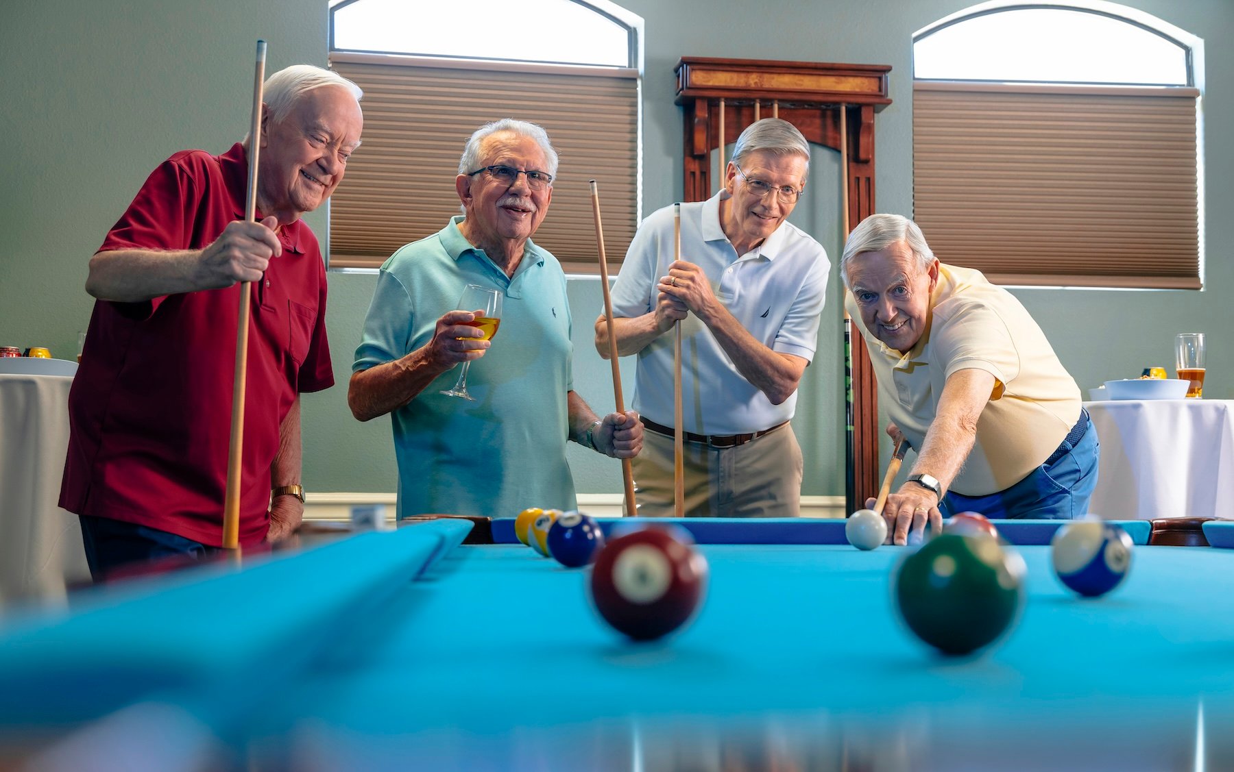 group of men playing pool 